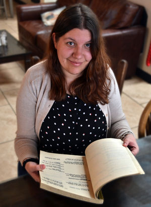 Jessica flicks through the film script and screenplay.