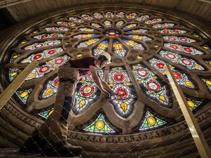 Supporting image for story: Craftspeople review Rose Window repairs carried out after 1984 York Minster fire