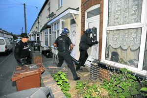 The door to the house where Arif was found crumbled as police forced their way in