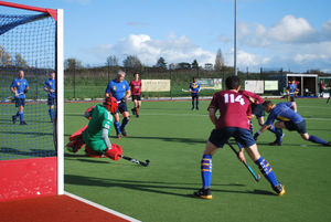 Stourport's keeper dives to block Bournville