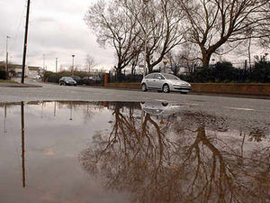 Supporting image for story: Gallons of water in the road