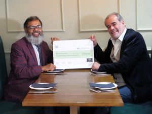 Supporting image for story: Indian restaurant serves up donation for Lichfield charity