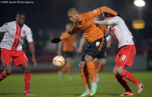 Wolves' Leon Clarke holds off his opponent to control the ball