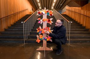 Councillor Garry Perry next to the Tree of Hope at New Art Gallery, Walsall.