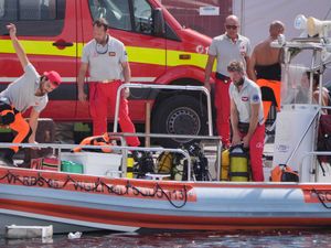 Supporting image for story: Search for six people missing in sunken superyacht enters third day