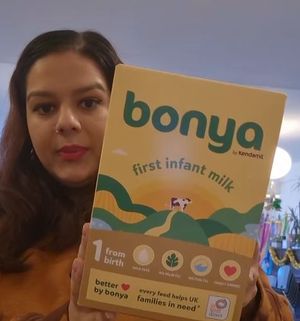 Neelam Heera-Shergill pictured with a box of Bonya First Infant Milk which was given out at an event with her charity Cysters