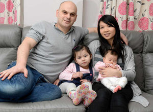 That's our girl – Jonathan and Lai-Chen Marshall with Isla, who has spastic diplegia, hampering her ability to walk correctly