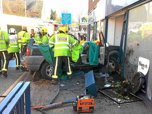 Supporting image for story: Driver injured after car collides with shop front