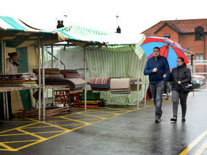 Supporting image for story: Oswestry market return is hailed despite rain