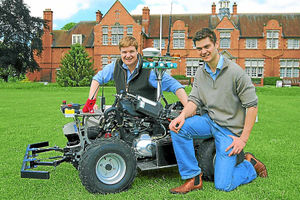 One of the labour saving devices  James Thomas and Kit Franklin test one of their robots at Harper Adams University.