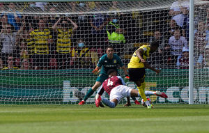 Watford's Emmanuel Dennis (right) scores their side's first goal of the game