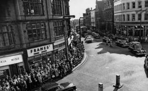 Crowds line the streets of Wolverhampton, as Sgt Stanford's coffin is about to pass the scene of his murder