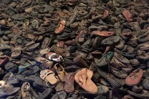 Piles of shoes are a pointer to the sheer number of lives lost