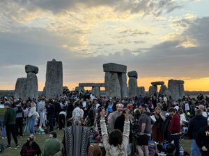Supporting image for story: Thousands brave the heat to watch summer solstice sunrise