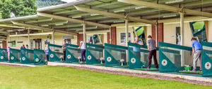 Golfers practising at the 28-bay floodlit driving range