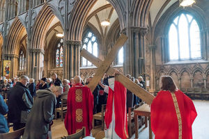 The cross being carried through the cathedral on Good Friday