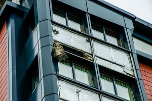 A close-up showing where a panel has been removed at Neale House