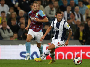 John Swift of West Bromwich Albion and Charlie Taylor of Burnley during the Sky Bet Championship between West Bromwich Albion and Burnley at The Hawthorns on September 3, 2022 in West Bromwich, United Kingdom. (Photo by Adam Fradgley/West Bromwich Albion FC via Getty Images).