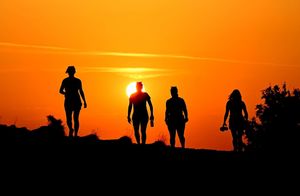 The Queen's Baton Relay at sunrise at the top of The Wrekin. Photo: @sambagnallphoto