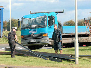 Supporting image for story: Lorry sheds load of girders at Market Drayton roundabout
