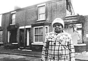 'Contractors have knocked down two houses in Wolverhampton by mistake. And today the council ordered them to stop working after being alerted by worries residents. The blunder in Lord Street, Chapel Ash, has left some of the occupied houses in the area with parts of their roofs missing.' Pictures is Mrs Lena Gray outside her house in Lord Street in November 1980.