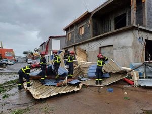 Rescue workers clearing an area in the cyclone-hit French territory of Mayotte