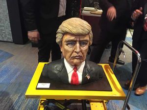 A cake moulded into the shape of Donald Trump's head arrives at his election night party in Manhattan