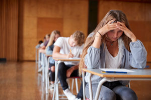 Young person stressed undergoing exams