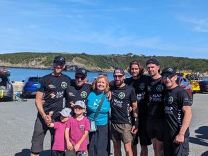 The Unskateables celebrating their journey's end in Cemaes Bay. Photo: Bethan Scott
