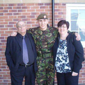 John with his parents, father James and mother Alison