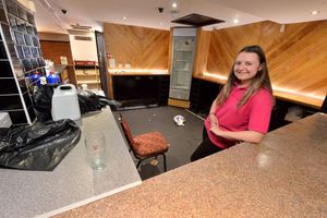 Outreach worker Cherry Teearu in the old bar, which will become a kitchen area 