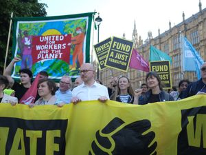 Climate activists and trade unionists protest outside Parliament
