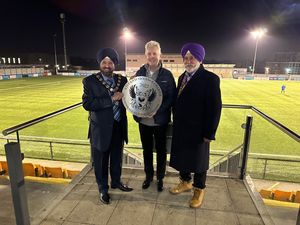 Clive Knowles presents a plaque to left, Slough Mayor Councillor Dilbagh Parmar and Councillor  Balvinder Bains, Slough Borough Council cabinet member whose portfolio includes community safety.
