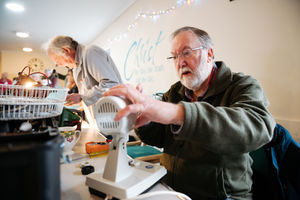 Dace Cowell fixing a fan