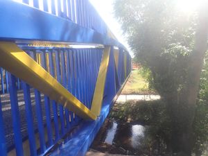 The Meole footbridge - and its blue and amber paint job - was lifted into place over the weekend.