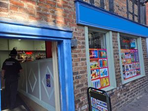 Police raiding one of the shops