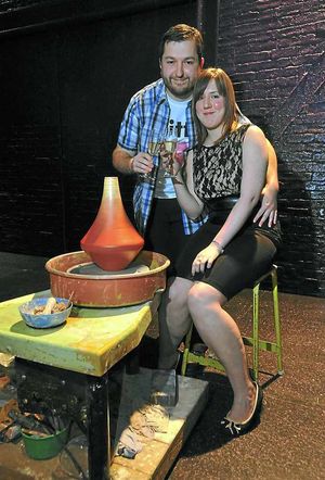 The newly-engaged couple enjoy a champagne moment