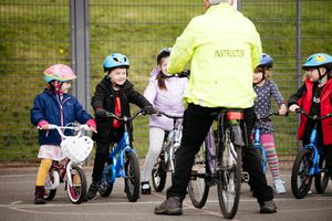 Youngsters taking part in a children's cycling training session with Instructor Nick Jenko.