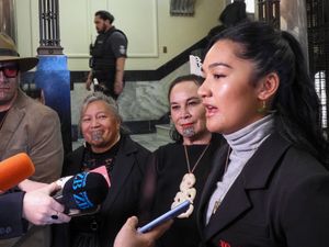 Hana-Rawhiti Maipi-Clarke, right, and her colleagues from the Te Pati Maori party, talk to reporters after a protest inside parliament in Wellington, New Zealand, in November 2024