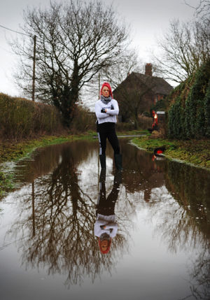 Julia Mytton in the flooded lane