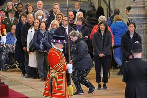 People pay their respects to the Queen in Westminster Hall after waiting in line for more than 12 hours
