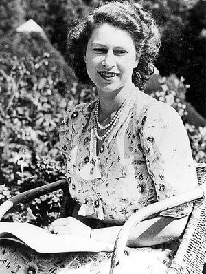 At the age of 21, a famous smile lights up the face of the future monarch
