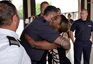Josefina hugs firefighter Irvin Rudge.