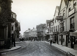 nostalgia pic. Ludlow. The Bull Ring and Corve Street, Ludlow, with the King's Arms and The Feathers Hotel on the right - Feathers is a famous black and white timbered building.  Date: 1910. Credit: Shropshire Records and Research Centre. NOT AVAILABLE FOR ORDER. REFER ORDERS TO SRRC. Ludlow street scene, general view, showing The Feathers Hotel, Ludlow, centre right. Library code: Ludlow nostalgia 2000.