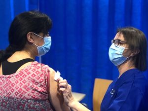 Dr Anja Pinhorn receving the vaccine