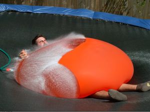 Supporting image for story: This giant water balloon bursting in slow motion is strangely satisfying to watch
