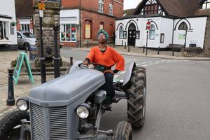 Street poet Trigger Bliss takes to a tractor as she performed on Sunday
