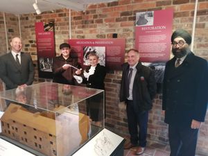 Deputy mayor of Broseley councillor Mark Garbett, left, Shropshire High Sheriff Dean Harris, centre, and town mayor councillor Tarlochen Singh-Mohr, right, with members of Broseley Pipeworks museum