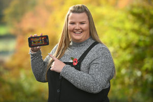 Jodie Scullion, 22, from Birmingham, celebrating her £1 million win