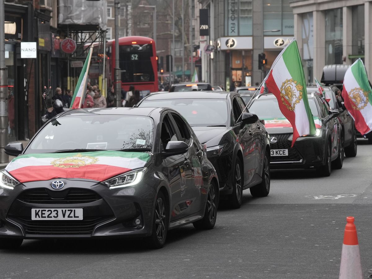 Demonstrators gather outside Iranian embassy in support of war